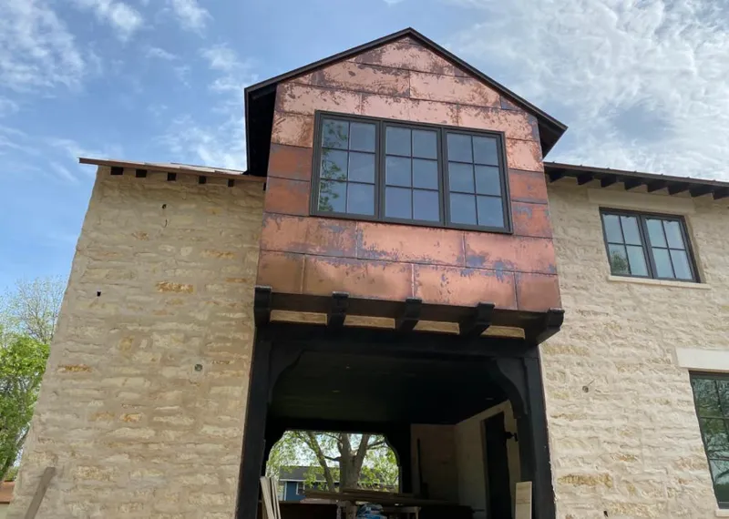 Copper metal panel facade on a stone building for Roof Repair in Thibodaux