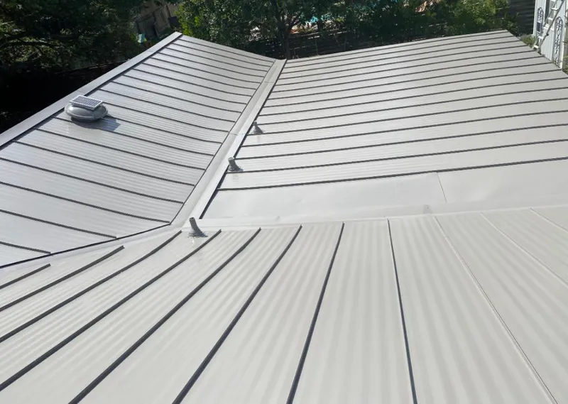 Solar attic fan installed on a metal roof for Roof Ventilation in Thibodaux